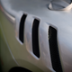 Exposed aluminium is far more elegant than exposed carbon fiber